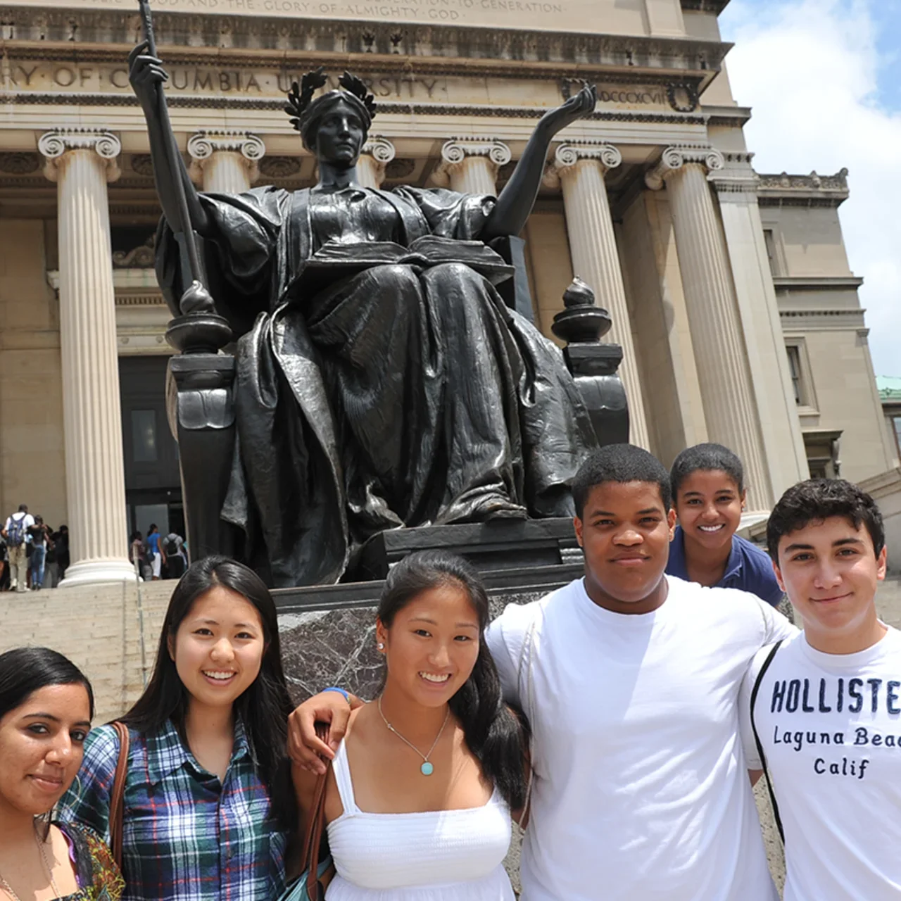 A group of students in front of Alma on the steps of Low Library.