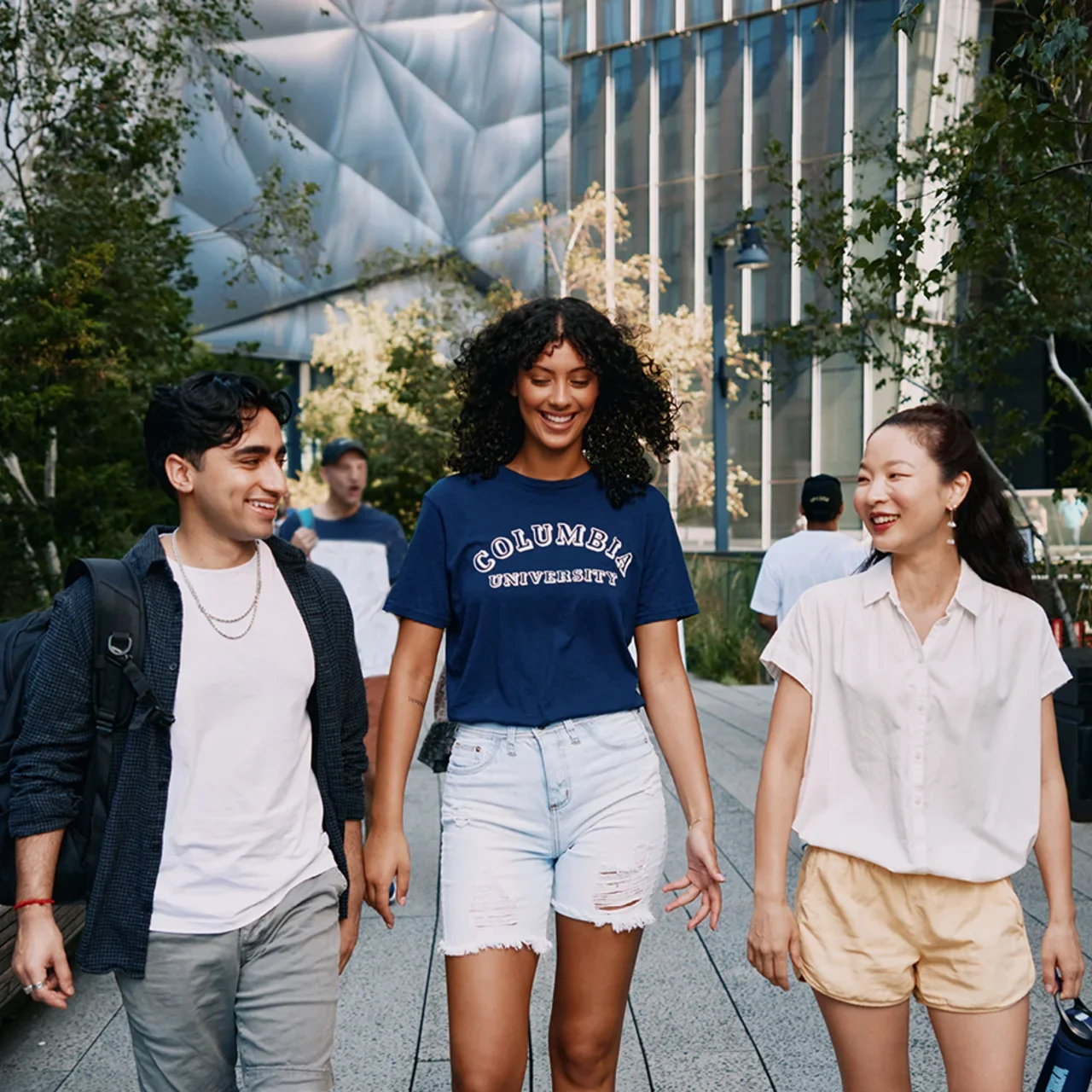 Three students walk along the High Line in NYC.