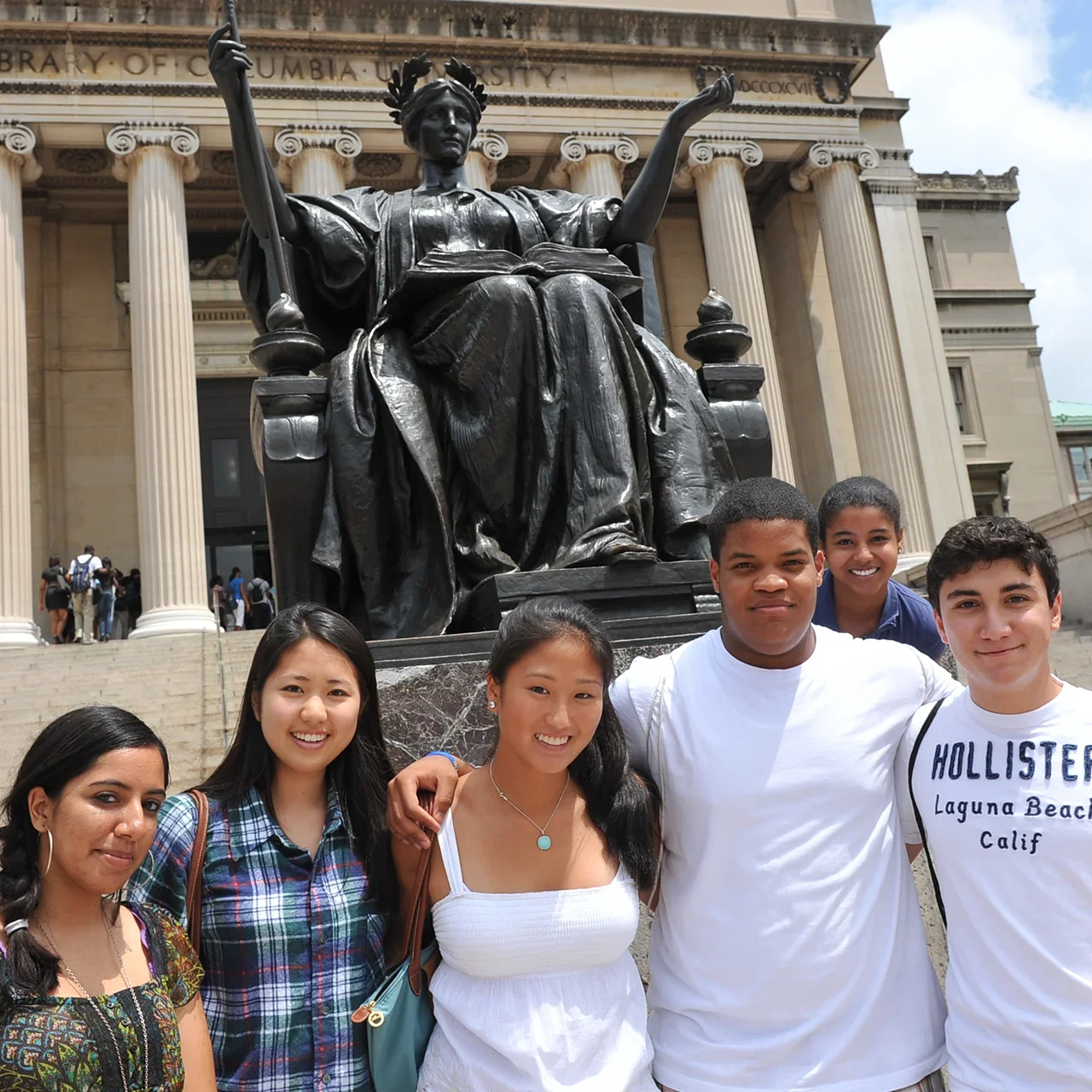 A group of students in front of Alma on the steps of Low Library.
