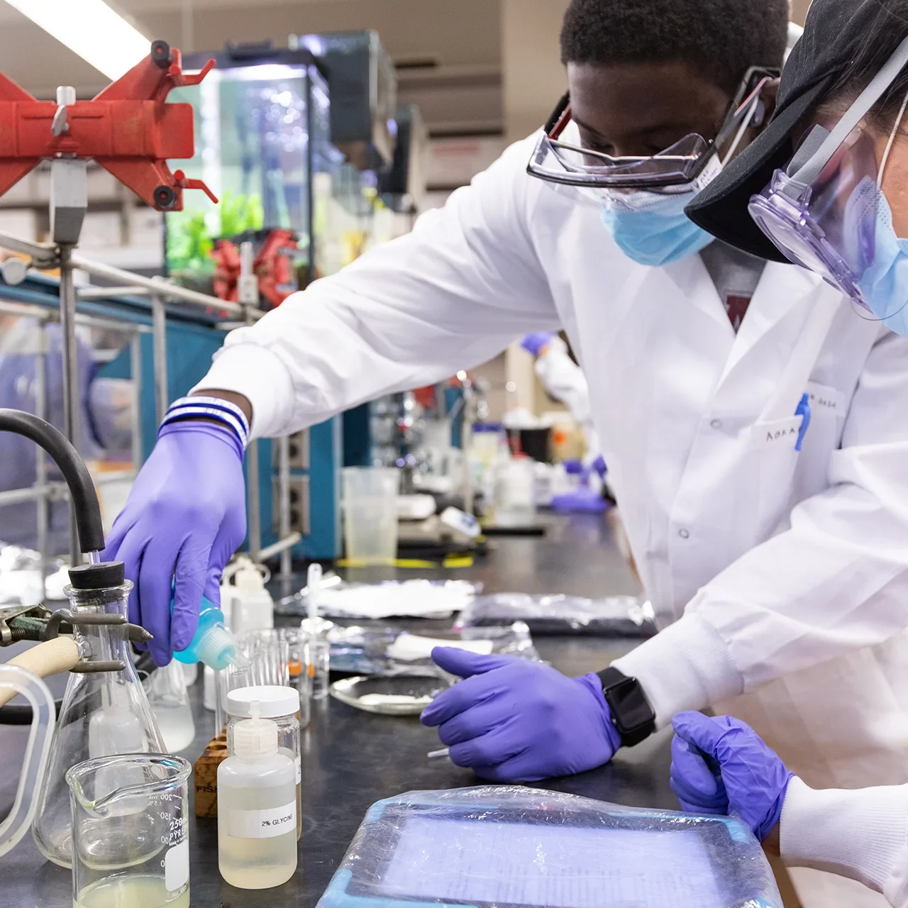 Two students work in a lab.