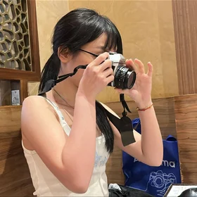Image of a Summer Student using a Camera