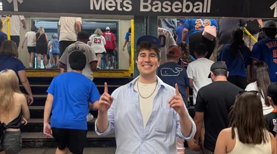 Student at the Mets stadium subway platform 