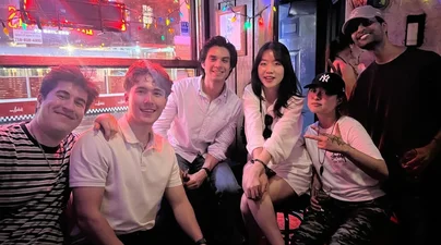 Yigit and friends at a bar in the West Village